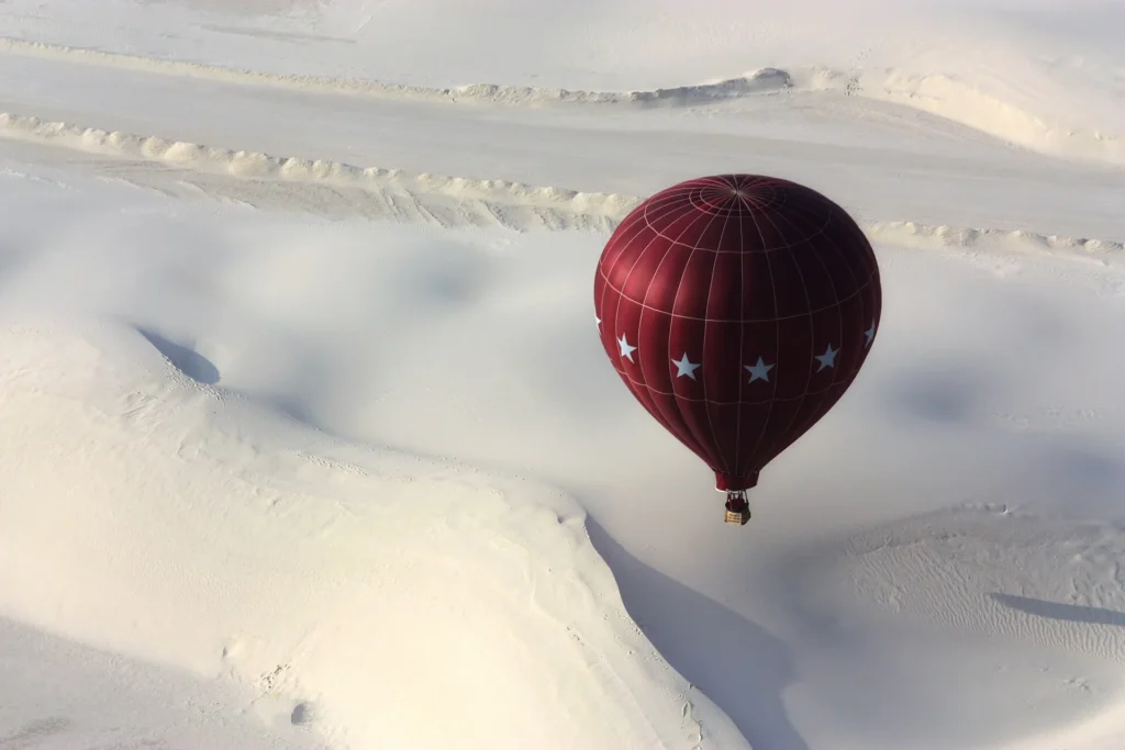 Hot air balloons rising over the white dunes of White Sands, New Mexico